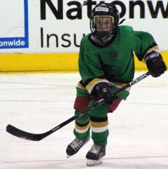 Brendan playing hockey